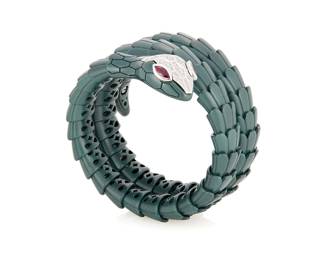 220
Alexis NY: A Titanium, 18K White Gold, and Diamond Snake Bracelet
Of a flexible design, featuring marquise-shaped ruby eyes with accents of round diamonds weighing approximately 1.05 carats, signed Alexis NY

Inner circumference: 6 in., flexible
59.4 grams gross
Estimate: $4,000 - $6,000