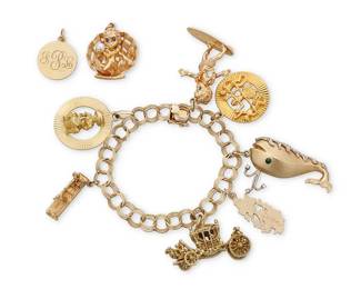 77
A Gold and Gem-Set Charm Bracelet
Suspending seven charms including a surfing figure, Jamaica and a limbo charm, together with two loose charms including a gold clam shell charm and Tiffany & Co. Monogram charm

Length: 7 in., Charms: 1 - 1 3/4 in.
78.0 grams gross
Estimate: $5,000 - $7,000