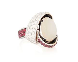 215
An 18K White Gold, Moonstone, Ruby and Diamond Ring
Featuring an oval moonstone cabochon measuring approximately 17.46 x 13.10 mm, accented by round rubies and diamonds

Size: 7 1/4
24.2 grams gross
Estimate: $1,200 - $1,800