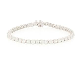 239
A Platinum and Diamond Bracelet
Featuring forty-four oval diamonds weighing approximately 11.09 carats

length: 7 1/2 in.
16.0 grams gross
Estimate: $12,000 - $18,000