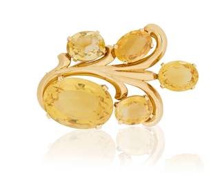 193
A 14K Gold and Citrine Brooch
Of a scrolling design featuring five oval citrines of various sizes

Measures: 2 5/8 x 1 1/2 in.
39.2 grams gross
Estimate: $2,500 - $3,500