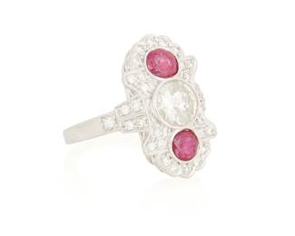 44
A 18K White Gold, Ruby and Diamond Ring
Centering a round diamond weighing approximately 1.05 carats, accented by two round rubies weighing approximately 1.20 carats set in an ornate diamond accented mount

Size: 6 3/4
7.6 grams gross
Estimate: $1,000 - $1,500