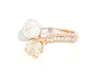139
An 18K Bi-Color Gold, Colored Diamond and Diamond Ring
Featuring a cushion-cut yellow diamond weighing approximately 0.85 carat, and a cushion-cut near colorless diamond weighing approximately 1.02 carats, accented by round diamonds on the shank

Size: 6 1/2
5.1 grams gross
Estimate: $2,500 - $3,500