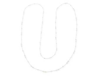 127
A 14K White Gold and Diamond Long Chain
Featuring stations of square-cut, round and pear-shaped diamonds weighing approximately 15.15 carats

Length: 66 in.
17.9 grams gross
Estimate: $5,500 - $6,500