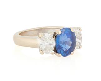 38
An 18K White Gold, Sapphire and Diamond Ring
Centering an oval modified brilliant-cut sapphire weighing approximately 3.49 carats, flanked by two oval diamonds weighing approximately 0.62 carat each, signed A/L

Size: 6 1/4
8.7 grams gross

Accompanied by a AGL Report numbered #1151599, dated October 29, 2025, stating the Sapphire is natural Corundum of Madagascar origin with no enhancements.
Estimate: $7,000 - $10,000