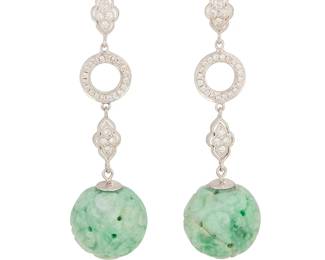 32
A Pair of 18K White Gold, Platinum, Jade and Diamond Earrings
Featuring ornate and round links set with round diamonds weighing approximately 0.28 carat, suspending round carved jade beads
2 pieces

Measures: 2 x 1/2 in.
13.7 grams gross
Estimate: $800 - $1,200