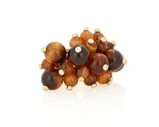 224
Aletto Brothers: An 18K Gold, Tiger's Eye and Diamond Ring
Featuring twenty-two graduated sizes of tiger's eye beads measuring approximately 5.10 - 8.25 mm in a dangling design, each accented by a singular round diamond, signed Aletto Bros.

Size: 6
21.1 grams gross
Estimate: $4,000 - $6,000
