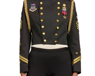 309
Gail Dauer: A Vintage Military Inspired Cropped Jacket
Circa 1980s-1990s
Label: Gail Dauer / Beverly Hills
A short fitted black suiting fabric double-breasted jacket, with gold tone buttons, epaulets, and various applied military badges, metallic braid stripes, pins, and medals, with aiguillette-style gold cording braid to shoulders, fully lined in black twill

No size tag
Measurements: CB length: 19 3/4 in.; bust across front: 18 1/2 in.; waist across front: 15 1/2 in.; across shoulders at back: 14 1/4 in.; sleeves: 24 in.
Estimate: $800 - $1,200