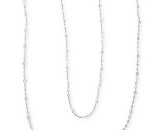 37
A 14K White Gold and Diamond Long Chain
Featuring one hundred and eighty-four varying sizes of round diamonds weighing approximately 51.50 carats

Length: 68 in.
41.7 grams gross
Estimate: $18,000 - $25,000