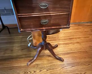 Nice old sewing cabinet. Top drawer rotates out for spool rack. 