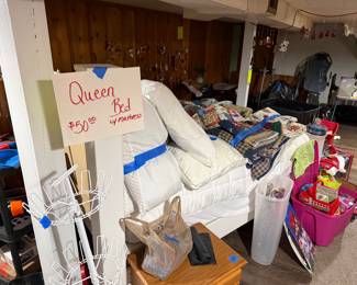 Queen bed with mattress. A lot of bedding, Easter stuff