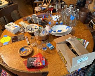 Beautiful old round oak table with six chairs. Old dishes. Miscellaneous glass. 