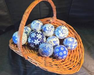 Collection Of Porcelain Orbs With Wicker Basket