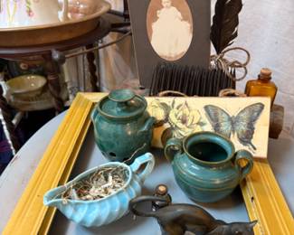 metal cat figurine, pottery, old photographs