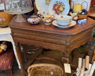 antique table, platters, baskets