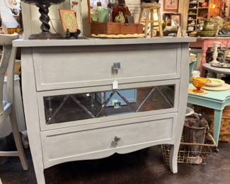 Beautiful art deco light grey dresser with mirrored drawer fronts featuring a geometric pattern and crystal-style knobs 