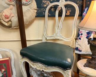 Beautiful vintage carved chairs with dark green leather seats with nailhead detail 