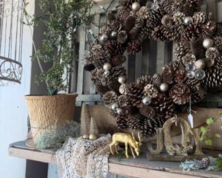 pine cone wreath, greenery, gold deer figurines