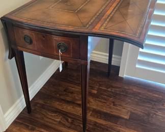 Antique tooled leather drop leaf table 