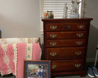 Chest of drawers and afghans. 