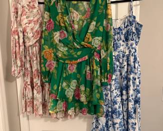 Left to right: pink floral H&M dress, green floral Zara dress, blue floral midi length abercrombie dress