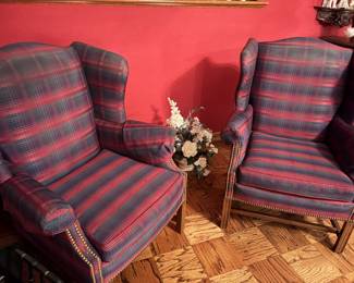 Two upholstered wing back chairs