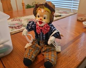 Cloth clown on a swing