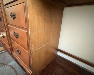 C34 - $25. Wooden Office Desk. 4 Drawers. Measures 40" wide x 17" deep x 30.5" tall. Sturdy. Heavy wear/chewing? on right front leg. 