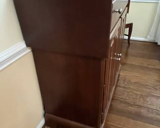 C17 - $125. *Tall* Server Cabinet. Measures 44" wide x 20" deep x 44.25" tall. Each drop leaf can add an extra 11.75". Drawer slides easily. Panel back needs reattached in a few places. 