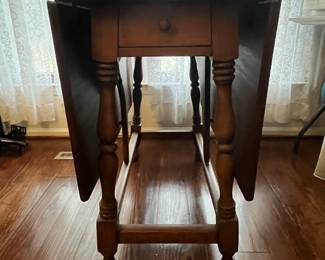 C48 - $75. Adorable Drop Leaf Table. The perfect size to use as an entry table or sofa table when not in use - or the right size for a 4 person dining table! Solid wood in very good condition with one exception - photographed. Measures 36" wide x 16" deep x 30" tall. Each Leaf adds 17.5". 