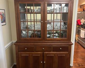 C15 - $95. Lighted China Display Cabinet. No name that we can find. Back paneling needs reattached and one latch needs a screw. Drawers all slide and doors open & close! Measures 57" wide x 82" tall x 17" deep bottom x 13" deep top. 