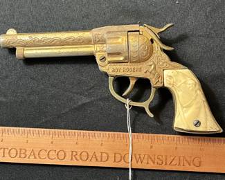 C59 - $60. Roy Rogers Forty Niner Pistol Cap Gun. Gold Plated. Comes with Red Ryder leather holster. 