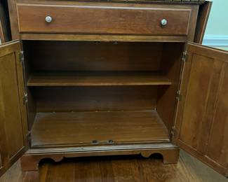 C17 - $125. *Tall* Server Cabinet. Measures 44" wide x 20" deep x 44.25" tall. Each drop leaf can add an extra 11.75". Drawer slides easily. Panel back needs reattached in a few places. 
