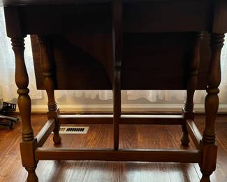 C48 - $75. Adorable Drop Leaf Table. The perfect size to use as an entry table or sofa table when not in use - or the right size for a 4 person dining table! Solid wood in very good condition with one exception - photographed. Measures 36" wide x 16" deep x 30" tall. Each Leaf adds 17.5". 