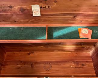 C39 - $40. Well Loved Lane Cedar Chest. Measures 44" wide x 19" tall x 17" deep. Outside has some veneer missing and significant use on the frame. Still very sturdy and useable!