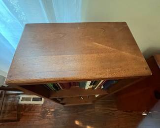C33 - $30. Narrow - wooden bookcase. Measures 14" wide x 8" deep x 37" tall. 