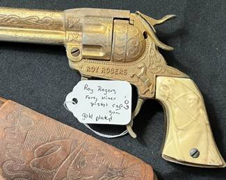 C59 - $60. Roy Rogers Forty Niner Pistol Cap Gun. Gold Plated. Comes with Red Ryder leather holster. 