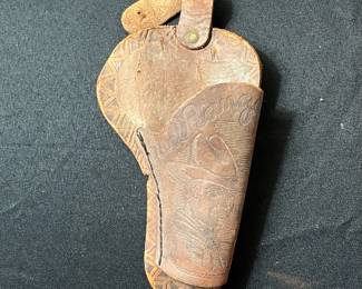 C59 - $60. Roy Rogers Forty Niner Pistol Cap Gun. Gold Plated. Comes with Red Ryder leather holster. 