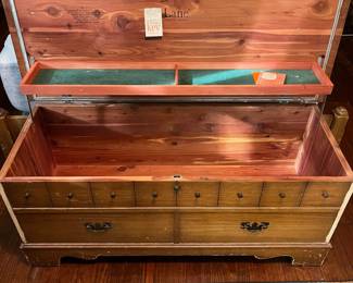 C39 - $40. Well Loved Lane Cedar Chest. Measures 44" wide x 19" tall x 17" deep. Outside has some veneer missing and significant use on the frame. Still very sturdy and useable!