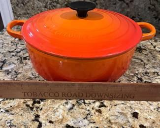 C9 - $125. Le Creuset #24 Dutch Oven Flame Orange. Small chip/ scratch on handle - otherwise in almost new condition. 