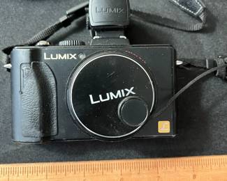 C67 - $60. Vintage Lumix Panasonic DMC-LX5 Digital Camera. W/ Live View Finder, Battery and Charger. Tested and Works.