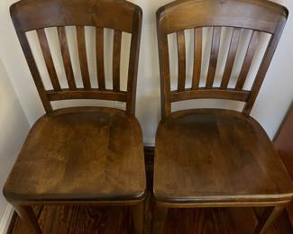C47 - $40 PAIR of vintage solid wood dining chairs. Both are sturdy - one has a crack in the seat. Measures 18.25" wide x 34.5" tall. 