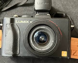C67 - $60. Vintage Lumix Panasonic DMC-LX5 Digital Camera. W/ Live View Finder, Battery and Charger. Tested and Works.