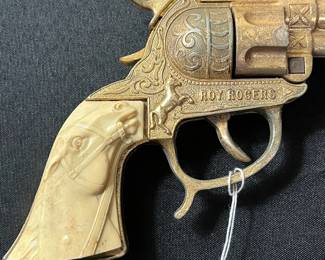 C59 - $60. Roy Rogers Forty Niner Pistol Cap Gun. Gold Plated. Comes with Red Ryder leather holster. 