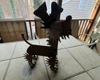 C94 - $25. Metal Yard Art Dog. Measures 15" x 6" x 18.5" tall. 