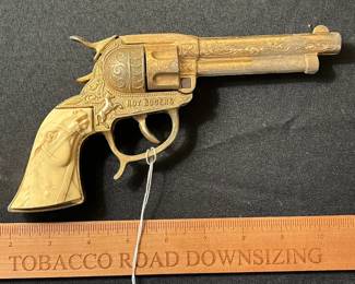 C59 - $60. Roy Rogers Forty Niner Pistol Cap Gun. Gold Plated. Comes with Red Ryder leather holster. 