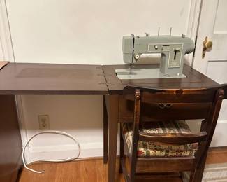 Vintage sewing machine, desk and chair --Working
