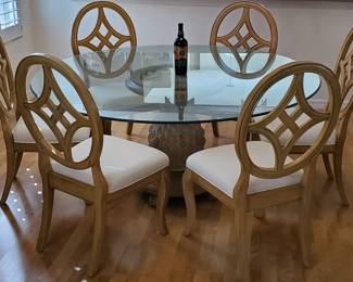 Beautiful Glass Top Dining Room Table with Pineapple Base and 6 Chairs and table pad. Matching lighted hutch.
