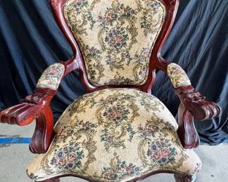 Armchair with a floral seat.