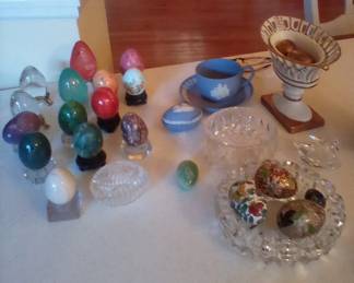 Crystal eggs, Wedgwood egg with tea cup and saucer, Jane Hucheson 4 in reticulated vase with brass eggs, Swarovski crystal swan